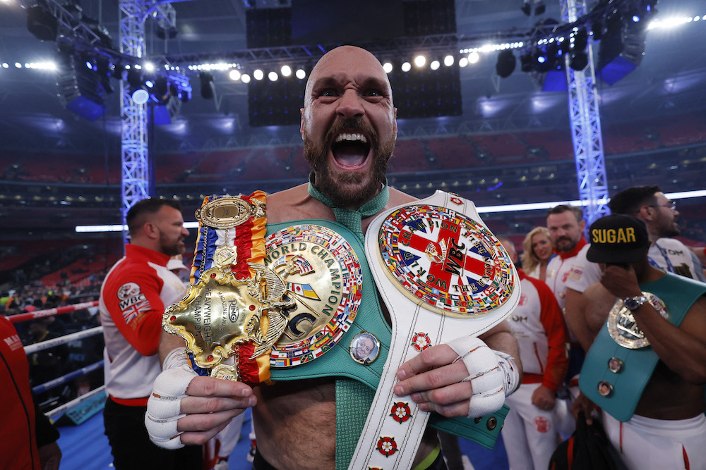 Tyson Fury celebrates with the belts after winning his fight against Dillian Whyte, London April 23, 2022. u00e2u20acu201d Action Images via Reuters/Andrew Couldridge