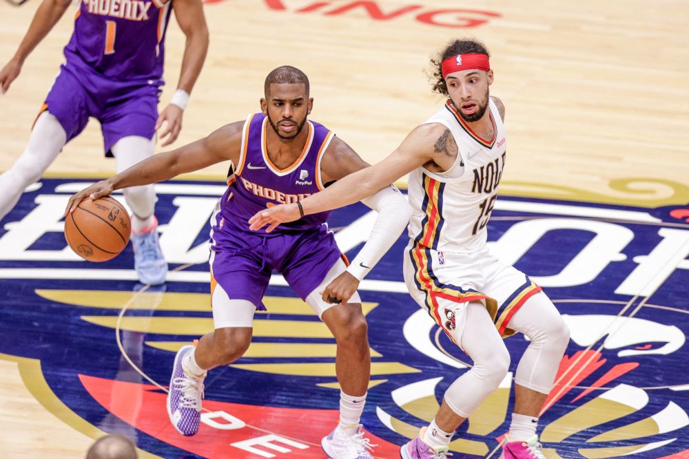 New Orleans Pelicans guard Jose Alvarado (15) reaches back for a steal attempt on Phoenix Suns guard Chris Paul (3) during the 2022 NBA playoffs in New Orleans April 28, 2022. u00e2u20acu201d Reuters picnn