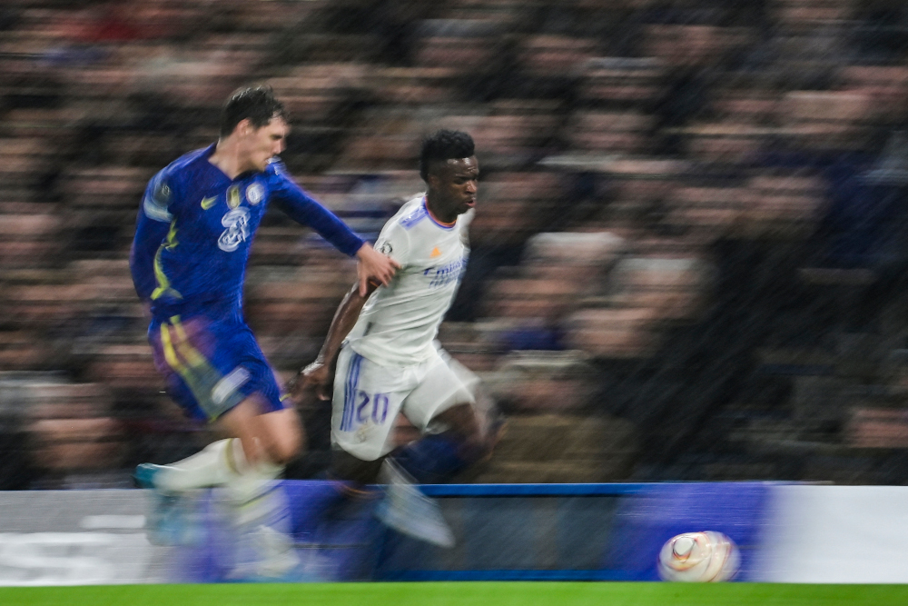 Chelsea defender Andreas Christensen fights for the ball with Real Madrid striker Vinicius Junior during the Uefa Champions League Quarter-final first leg at Stamford Bridge stadium in London, April 6, 2022. u00e2u20acu201d AFP picnn