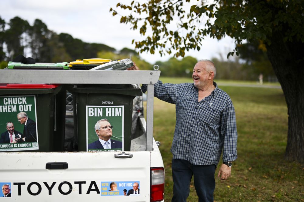 A protester is seen waiting for Australian Prime Minister Scott Morrison outside Government House ahead of a likely 21 May election in Canberra, Sunday, April 10, 2022. u00e2u20acu201d AAP Image/Lukas Coch via Reuters