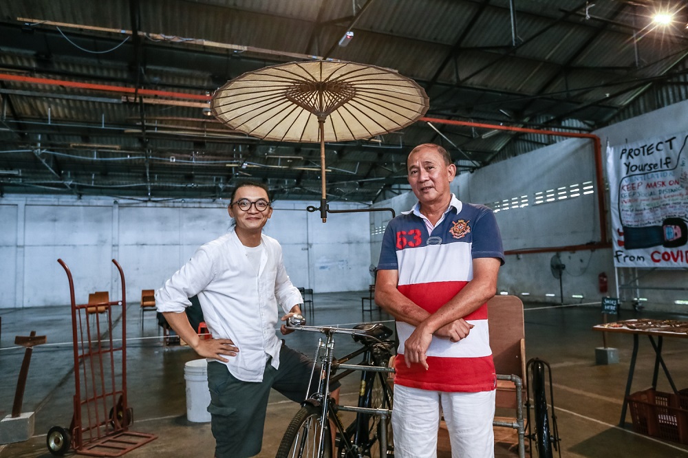 Lim (left) learnt how to make a cargo beca under Diong's guidance to archive and preserve the intricacies of the traditional Malaysian vehicle. u00e2u20acu2022 Picture by Devan Manuel