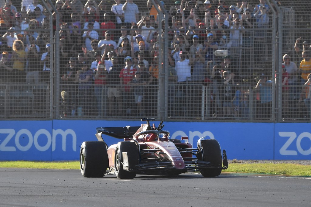 Ferrariu00e2u20acu2122s Monegasque driver Charles Leclerc acknowledges the crowd during his victory lap after winning the 2022 Formula One Australian Grand Prix at the Albert Park Circuit in Melbourne on April 10, 2022. u00e2u20acu201d AFP pic
