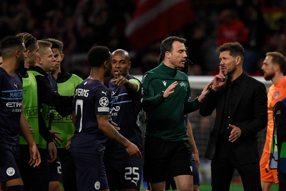 Atletico Madrid coach Diego Simeone (right) gestures next to Manchester Cityu00e2u20acu2122s players at the Wanda Metropolitano stadium in Madrid, April 13, 2022. u00e2u20acu201d AFP pic 