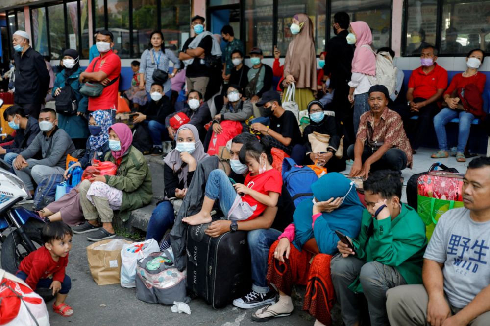 People wait for buses at Kampung Rambutan bus terminal, as Indonesian Muslims travel home to celebrate Eid al-Fitr, known locally as u00e2u20acu02dcMudiku00e2u20acu2122, in Jakarta, Indonesia, April 29, 2022. u00e2u20acu201d Reuters pic