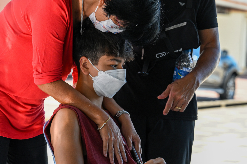 Esther Molina (left), mother of missing diver Alexia Alexandra Molina from France, hugs her son Franck Molina during ongoing search efforts to locate three divers who went missing off Malaysiau00e2u20acu2122s south-east coast in Mersing, Johor, April 8, 2022. u00e2u20acu201d AFP