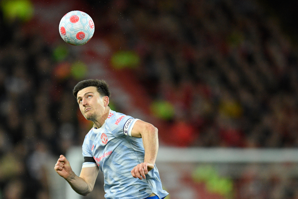 Manchester United defender Harry Maguire eyes the ball during the English Premier League match against Liverpool at Anfield in Liverpool, north-west England, April 19, 2022. u00e2u20acu201d AFP picn