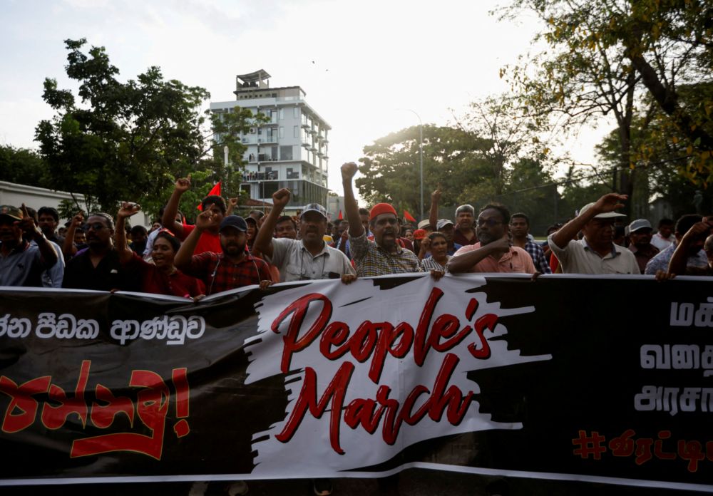 Members and supporters of Sri Lanka's opposition the National Peopleu00e2u20acu2122s Power Party march towards Colombo from Beruwala, during a protest against Sri Lankan President Gotabaya Rajapaksa, April 19, 2022. u00e2u20acu201d Reuters file pic