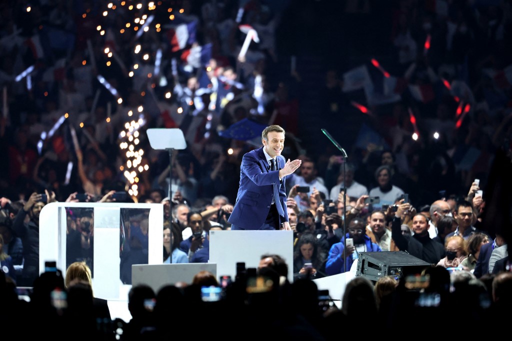 French President and liberal party La Republique en Marche (LREM) candidate for re-election Emmanuel Macron greets his supporters during his first campaign meeting at the Paris La Defense Arena, in Nanterre, April 2, 2022. u00e2u20acu201d AFP pic
