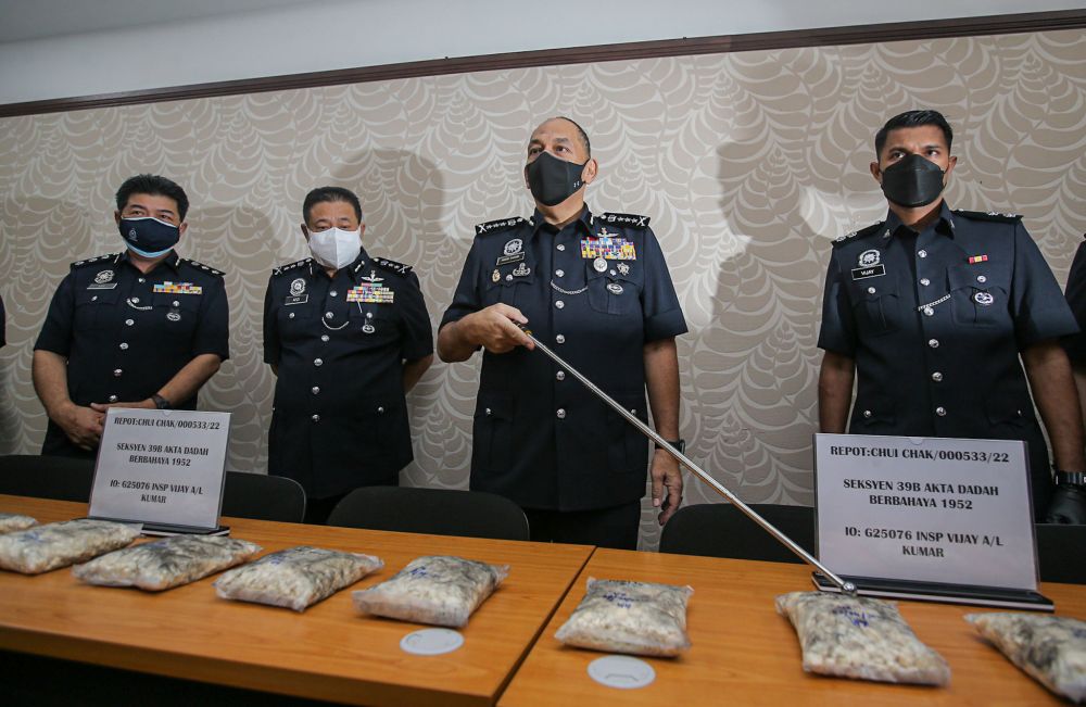 Perak police chief Datuk Mior Faridalathrash Wahid displays drugs seized during a recent bust at the Perak police headquarters in Ipoh April 8, 2022. u00e2u20acu201d Picture by Farhan Najib