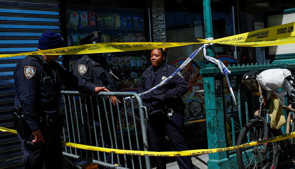 Law enforcement officers stand guard at the scene of a shooting at a subway station in the Brooklyn borough of New York April 12, 2022. u00e2u20acu2022 Reuters pic