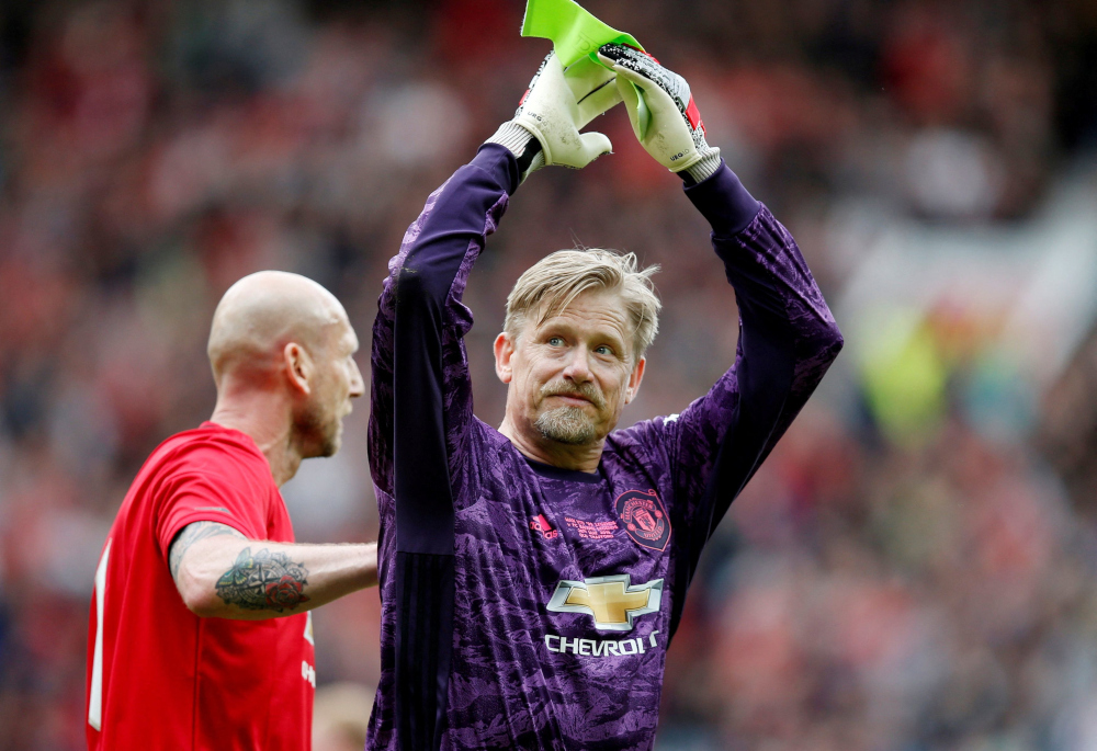 Peter Schmeichel applauds the fans as he is substituted in the 1999 Manchester Unitedu00e2u20acu2122s Treble Reunion Match v Bayern Munich Legends at Old Trafford, Manchester, Britain, May 26, 2019. u00e2u20acu201d Reuters pic
