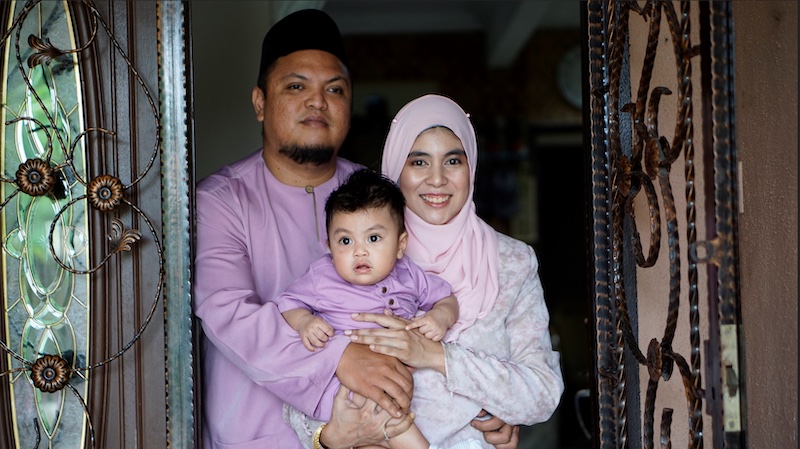 Local private palm oil research company's researcher, Aida Nazlyn and her husband along with her year-old son in 2020. — Picture courtesy of Aida Nazlyn