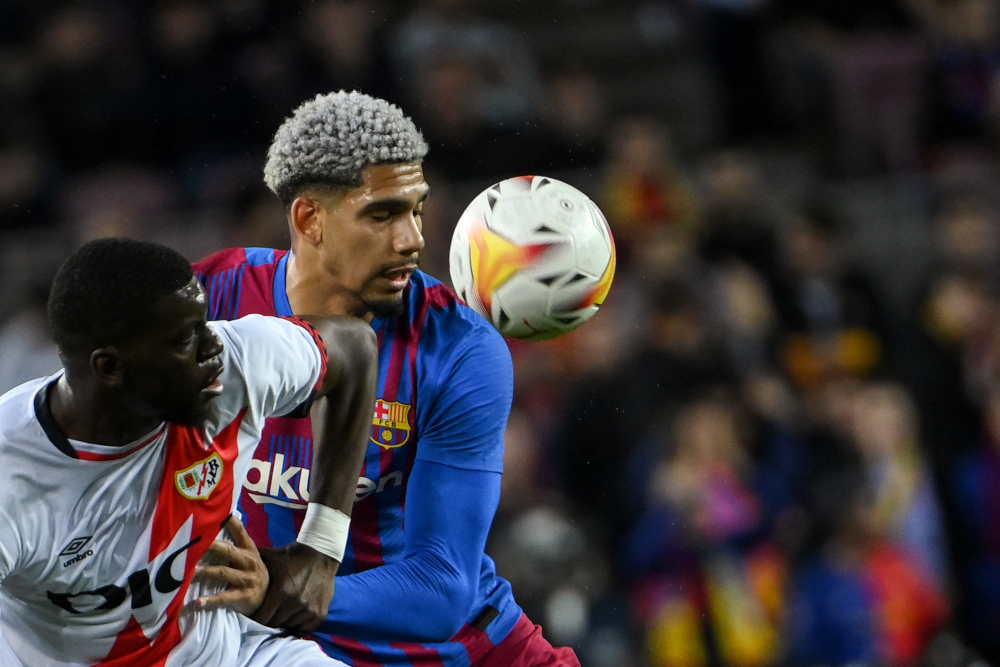 Barcelona defender Ronald Araujo vies with Rayo Vallecano midfielder Randy Nteka during the Spanish league match at the Camp Nou stadium in Barcelona, April 24, 2022. u00e2u20acu201d AFP pic 