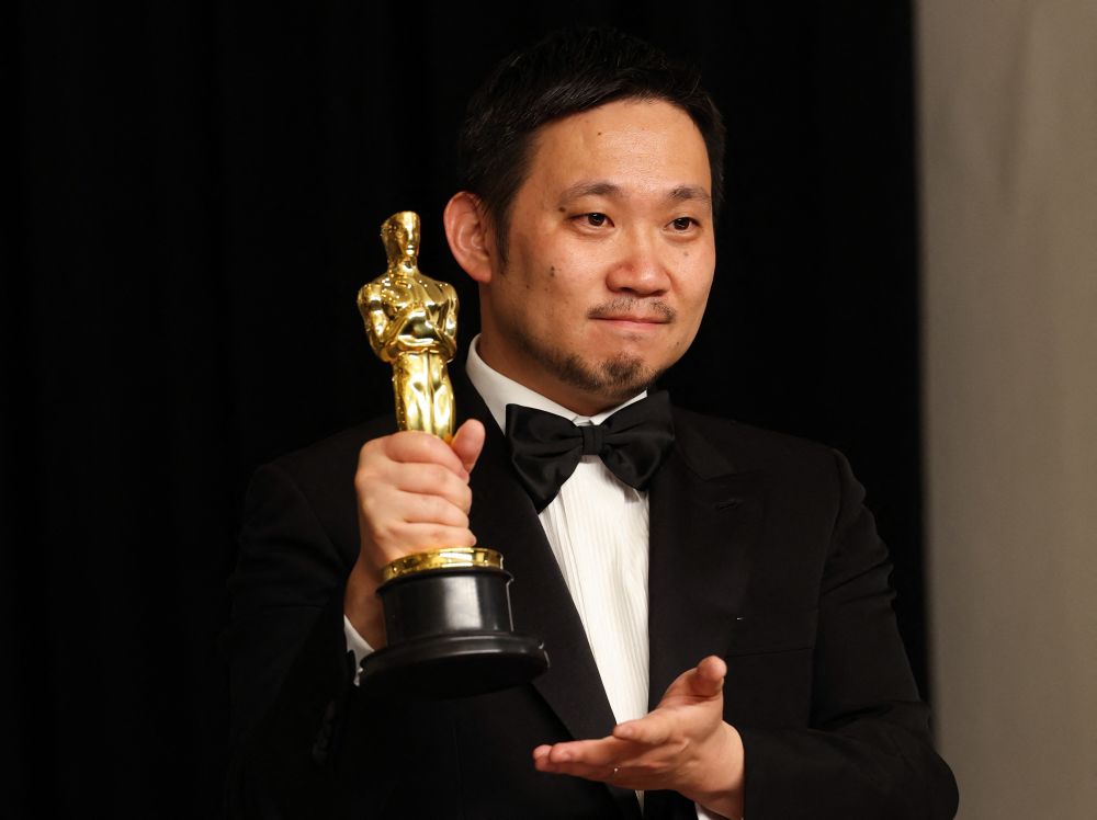 Director Ryusuke Hamaguchi poses with the Oscar for Best International Feature Film for u00e2u20acu02dcDrive My Caru00e2u20acu2122 in Hollywood, Los Angeles March 27, 2022.u00e2u20acu201d Reuters picnn