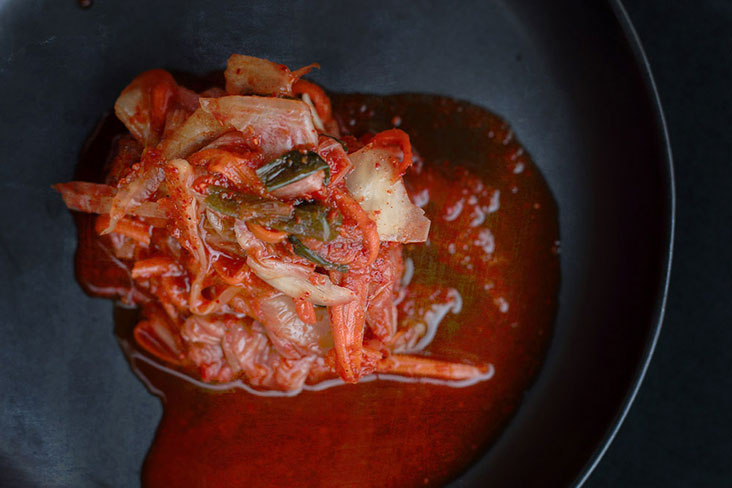 Kimchi plays a central part in this hodgepodge (decidedly non-Korean) stew.