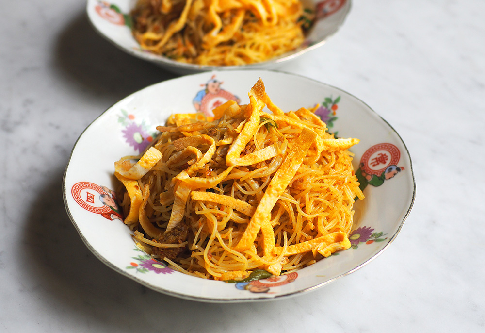 Don't miss out on their snacks like this mee Siam with soft, fragrant thin vermicelli strands flavoured with torch ginger flower and 'tom yam'.