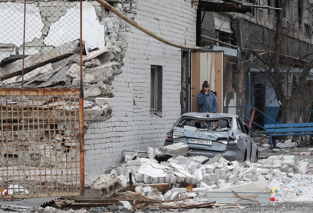 A local resident stands near an apartment building damaged during Ukraine-Russia conflict in the southern port city of Mariupol, Ukraine April 4, 2022. u00e2u20acu2022 Reuters pic