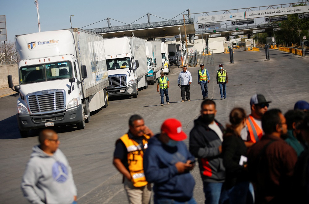 Truckers returning from the United States walk near their trailers while stranded as Mexican truck drivers block the Zaragoza-Ysleta International Bridge in Ciudad Juarez, Mexico April 12, 2022. u00e2u20acu2022 Reuters pic