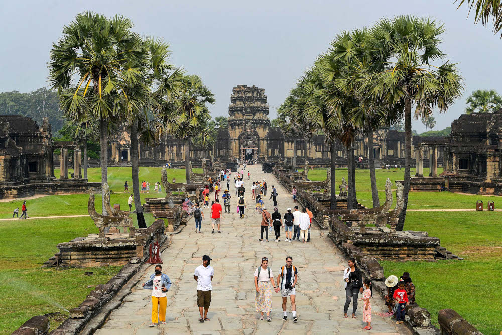 Tourists visiting the Angkor Wat temple complex, a Unesco World Heritage Site, in Siem Reap province. u00e2u20acu201d AFP pic