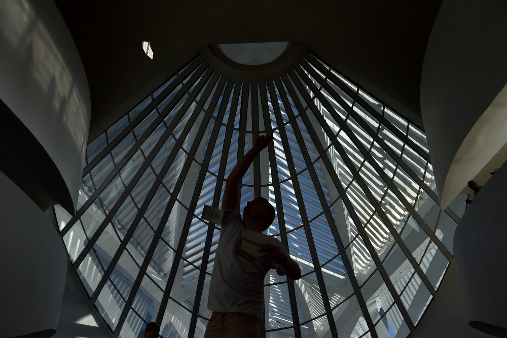 A competitor throws his paper plane during the national Red Bull Paper Wings paper airplane throwing championships at the Museum of Tomorrow in Rio de Janeiro, Brazil. u00e2u20acu201d AFP pic