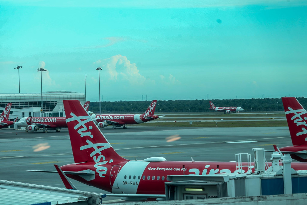 An AirAsia plane at Kuala Lumpur International Airport (KLIA2) on the first day of Malaysiau00e2u20acu2122s border reopening, April 1, 2022. u00e2u20acu201d Picture by Hari Anggara