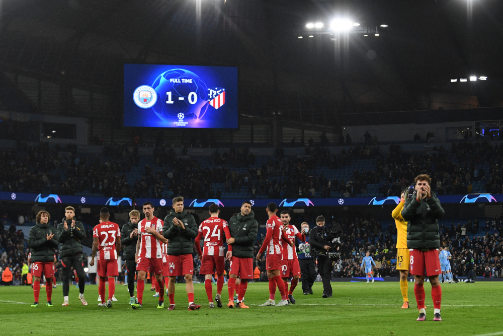 Atletico Madridu00e2u20acu2122s players applaud supporters on the pitch after the Uefa Champions League Quarter-final first leg match against Manchester City at the Etihad Stadium in Manchester, north-west England, on April 5, 2022. u00e2u20acu201d AFP pic