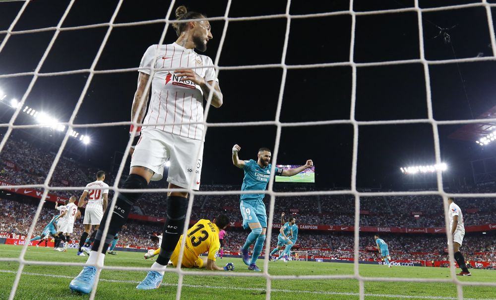 Real Madrid's Karim Benzema celebrates scoring their third goal against Sevilla with teammates at Ramon Sanchez Pizjuan, Seville April 17, 2022. u00e2u20acu201d Reuters pic