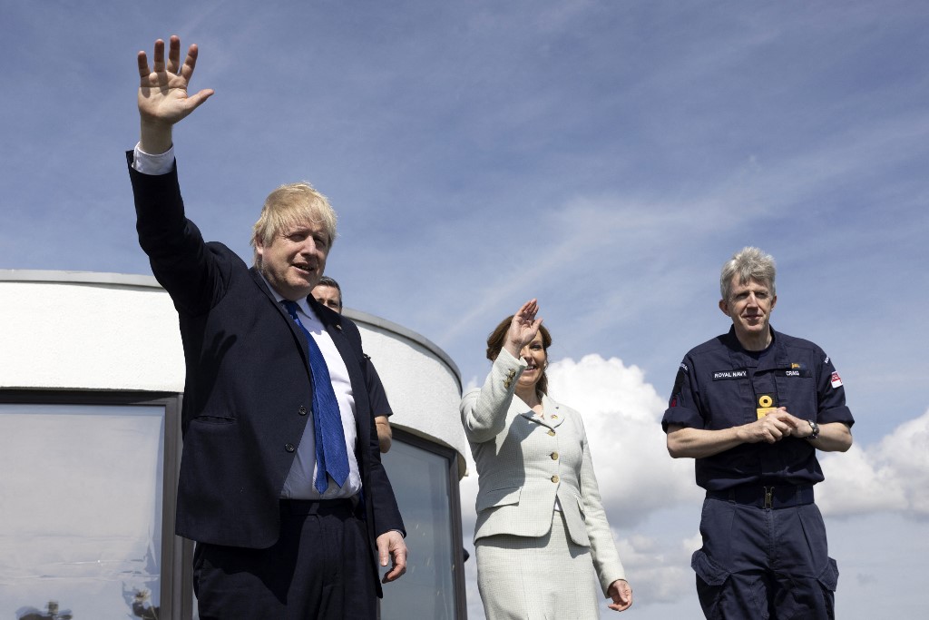 Britainu00e2u20acu2122s Prime Minister Boris Johnson (left) stands with Britainu00e2u20acu2122s Clandestine Channel Threat Commander Dan Ou00e2u20acu2122Mahoney (second left), as they look out over the English channel during his visit to the Maritime Rescue Coordination Centre in Dover, sou