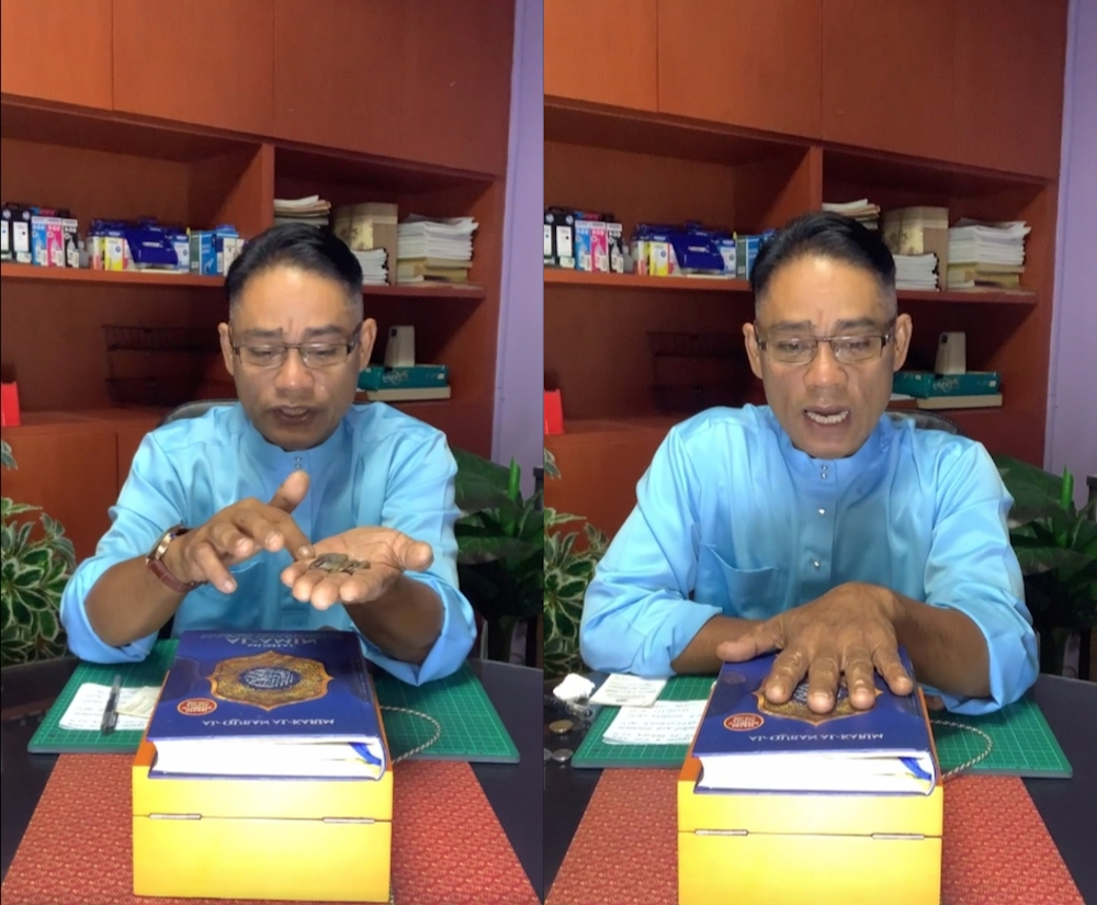 DJ Wong dramatically showing what money he has left and swearing on the Quran in his 15-minute video. u00e2u20acu201d Picture via Facebook/Ox5Family