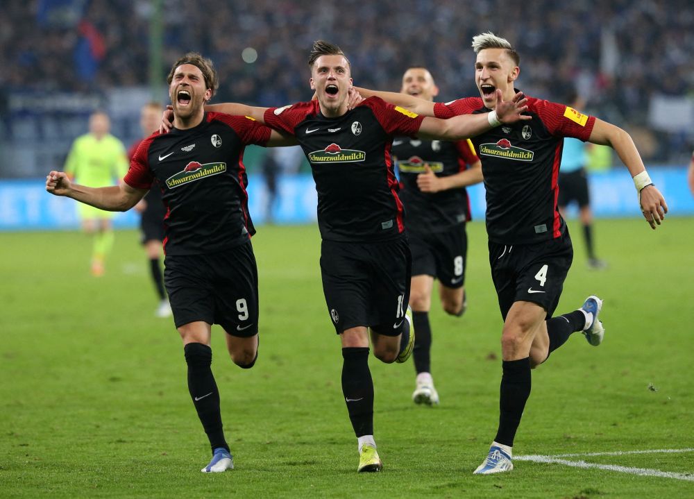 SC Freiburg players celebrate after the DFB Cup match against Hamburg at Volksparkstadion, Hamburg April 19, 2022. u00e2u20acu201d Reuters picn