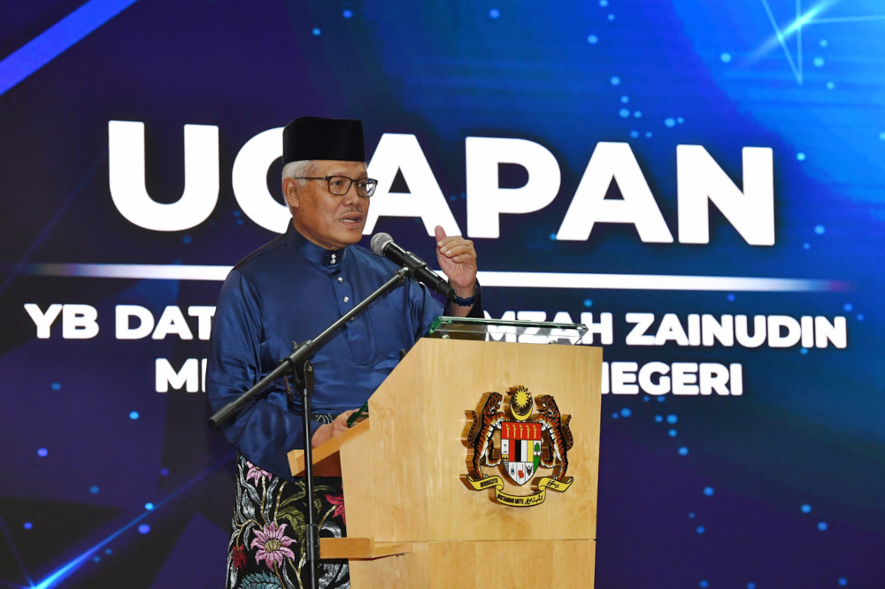 Home Minister Datuk Seri Hamzah Zainudin delivers a speech during a nationality status results presentation ceremony in Putrajaya, April 29, 2022. u00e2u20acu201d Bernama pic 