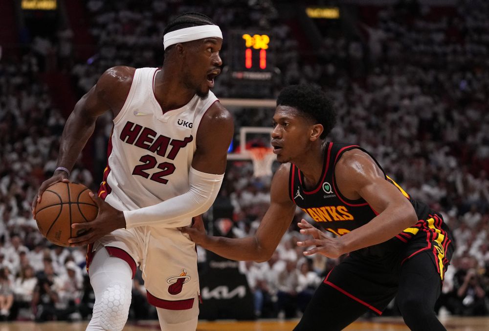 Miami Heat forward Jimmy Butler (22) controls the ball around Atlanta Hawks forward De'Andre Hunter at the FTX Arena in Miami April 20, 2022. u00e2u20acu201d Reuters pic
