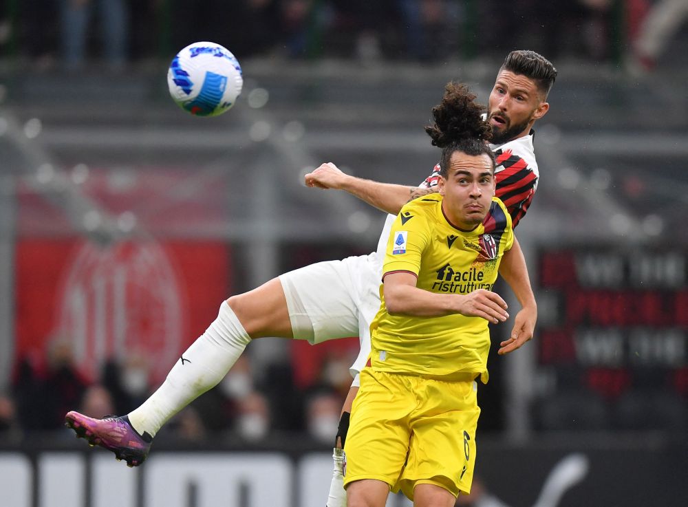 AC Milan's Olivier Giroud in action with Bologna's Arthur Theate at the San Siro, Milan April 4, 2022. u00e2u20acu201d Reuters pic n