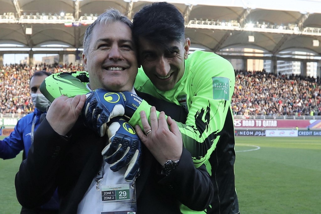 Iranu00e2u20acu2122s Croatian coach Dragan Skocic (left) and Iranu00e2u20acu2122s goalkeeper Alireza Beiranvand celebrate during the 2022 Qatar World Cup Asian Qualifiers match between Iran and Lebanon, at the Imam Reza Stadium in the city of Mashhad, March 29, 2022. u00e2u20acu201d AFP pic
