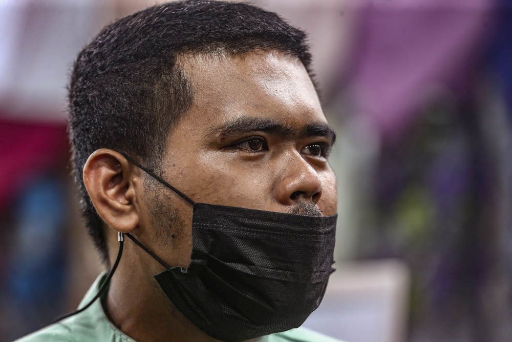 Rqal Exclusive staff Muhammad Rijalul Haq, 22, speaks to Malay Mail during an interview on Jalan Tuanku Abdul Rahman, Kuala Lumpur April 27, 2022. — Picture by Hari Anggara