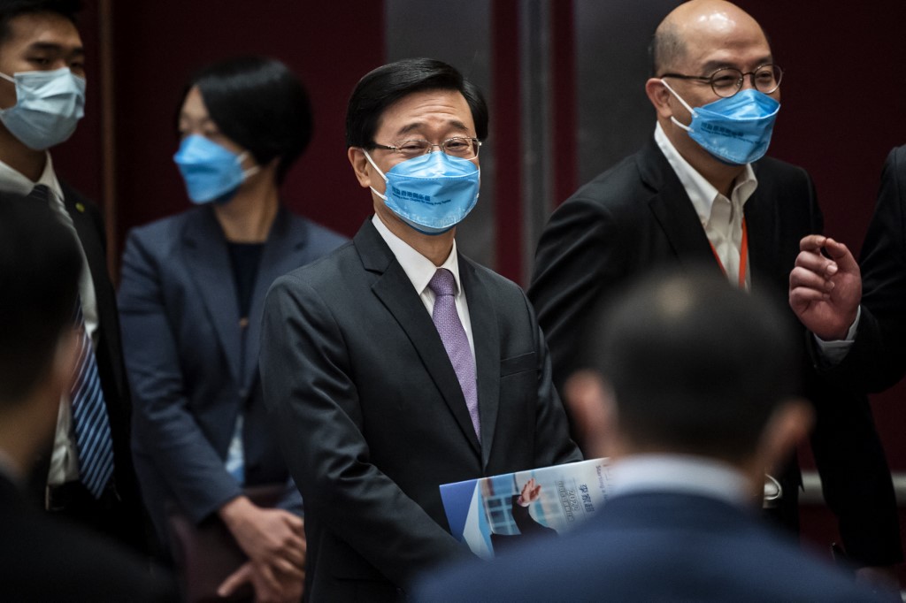 Hong Kongs former chief secretary John Lee (centre) leaves after introducing his election manifesto at an event in Hong Kong on April 29, 2022. u00e2u20acu201d AFP pic