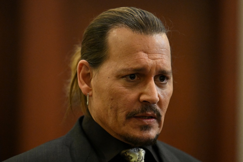 Actor Johnny Depp looks on at the Fairfax County Circuit Courthouse as his defamation case against ex-wife Amber Heard continues, in Fairfax, Virginia April 19, 2022. u00e2u20acu2022 Jim Watson/Pool via Reuters