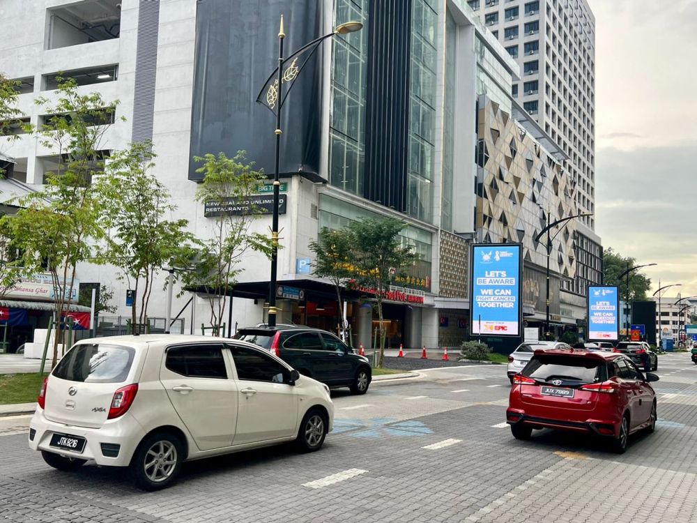 With the reopening of the border, Johor Baru city’s main route along Jalan Wong Ah Fook was busy.  — Picture by Ben Tan
