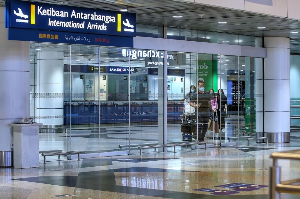 At 8.30am, checks by the Malay Mail found that the arrival hall was still quite empty but by 11.30am, as more flights landed, a small but steady stream of passengers were trickling through the gates. — Picture byAhmad Zamzahuri