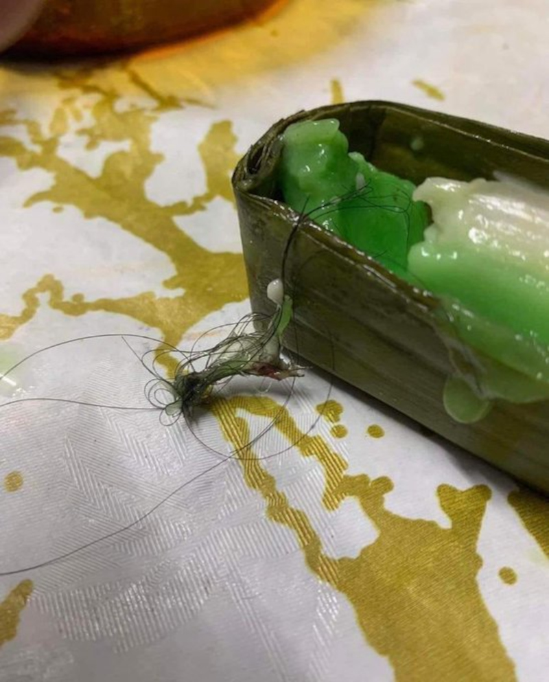 The u00e2u20acu02dckuih limasu00e2u20acu2122 containing a clump of hair, received from the complainant and allegedly bought at a Teluk Intan Ramadan Bazaar. u00e2u20acu201d Picture from Twitter/Bernama Radio