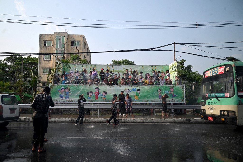 People celebrate Myanmaru00e2u20acu2122s New Year water festival, also known as Thingyan, in Yangon on April 16, 2022. u00e2u20acu201d AFP pic