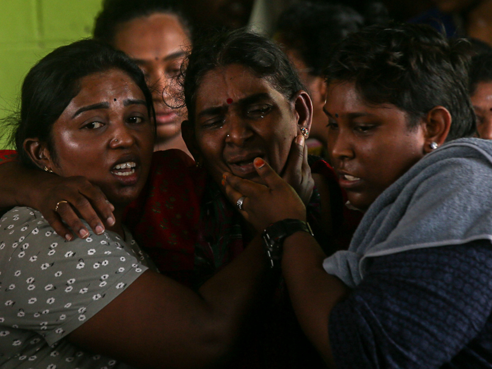 Nagaenthran’s mother Panchalai Supermaniam, 60, being consoled by relatives at her home in Tanjung Rambutan, Perak, April 29, 2022. — Picture by Farhan Najib 