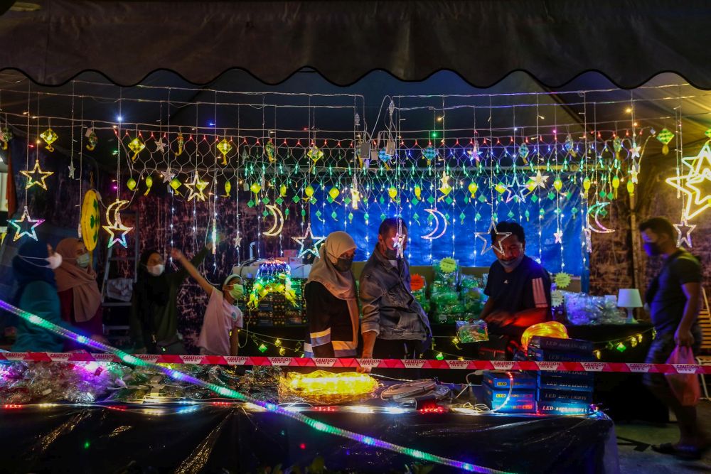 People shop for LED decorations ahead of  Raya celebrations in Chow Kit, Kuala Lumpur April 19, 2022. u00e2u20acu201d Picture by Hari Anggara