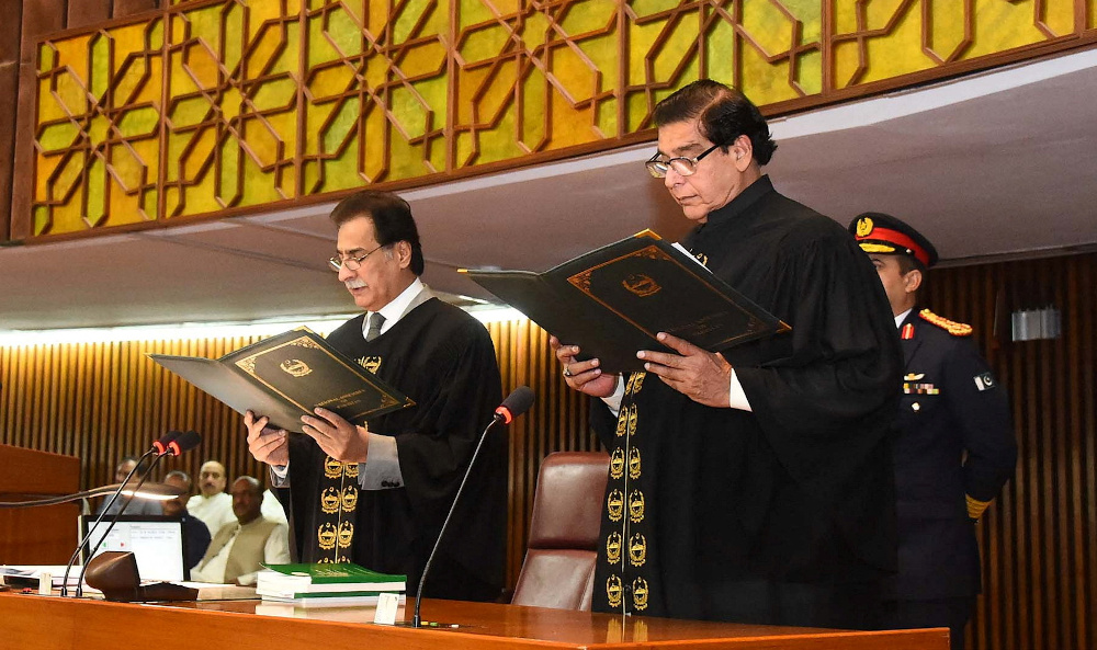 Raja Pervaiz Ashraf from the Pakistan Peopleu00e2u20acu2122s Party (PPP) takes an oath as the 22nd Speaker of the National Assembly of Pakistan from Ayaz Sadiq at the Parliament House April 16, 2022. u00e2u20acu201d Press Information Department (PID) pic via Reuters
