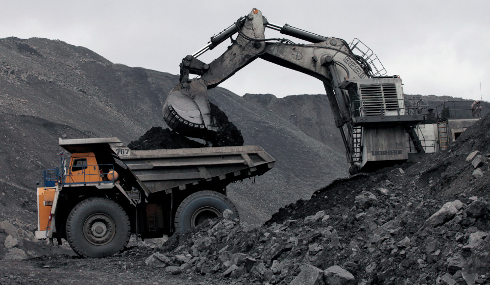 A machine loads a BelAZ dump-body truck with coal at the Chernigovsky opencast colliery, outside the town of Beryozovsky, Kemerovo region, Siberia April 4, 2016. u00e2u20acu201d Reuters pic