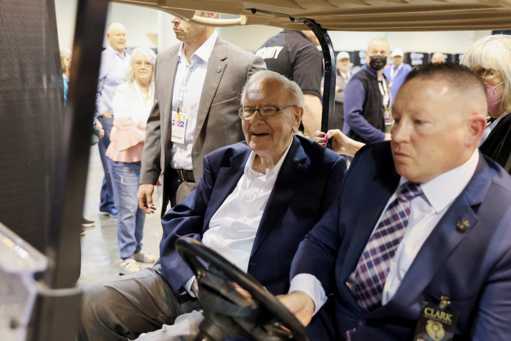 Berkshire Hathaway CEO Warren Buffett rides on a golf cart through the exhibition hall as investors and guests arrive for the first in-person annual meeting since 2019 of Berkshire Hathaway Inc in Omaha April 29, 2022. u00e2u20acu201d Reuters pic