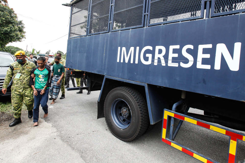 Rohingya detainees who fled the compound are brought back to Sri Impian Temporary Immigration Detention Centre, Bandar Baharu, Kedah, April 20, 2022. u00e2u20acu201d Picture by Sayuti Zainudin