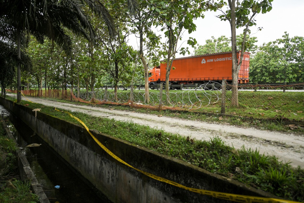 A collapsed fence near the North-South Expressway after Rohingya detainees who escaped from the Sungai Bakap Immigration Detention Depot near the Penang-Kedah border encroached into the highway, April 20, 2022. u00e2u20acu201d Bernama pic 