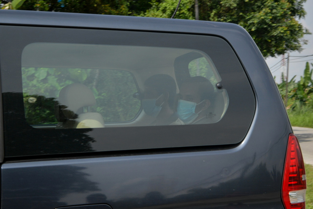 Two people believed to be Rohingya detainees who escaped from the Sungai Bakap Immigration Depot yesterday pictured in an Immigration Dept vehicle in Bandar Baharu, Kedah, April 21, 2022. u00e2u20acu201d Bernama pic 