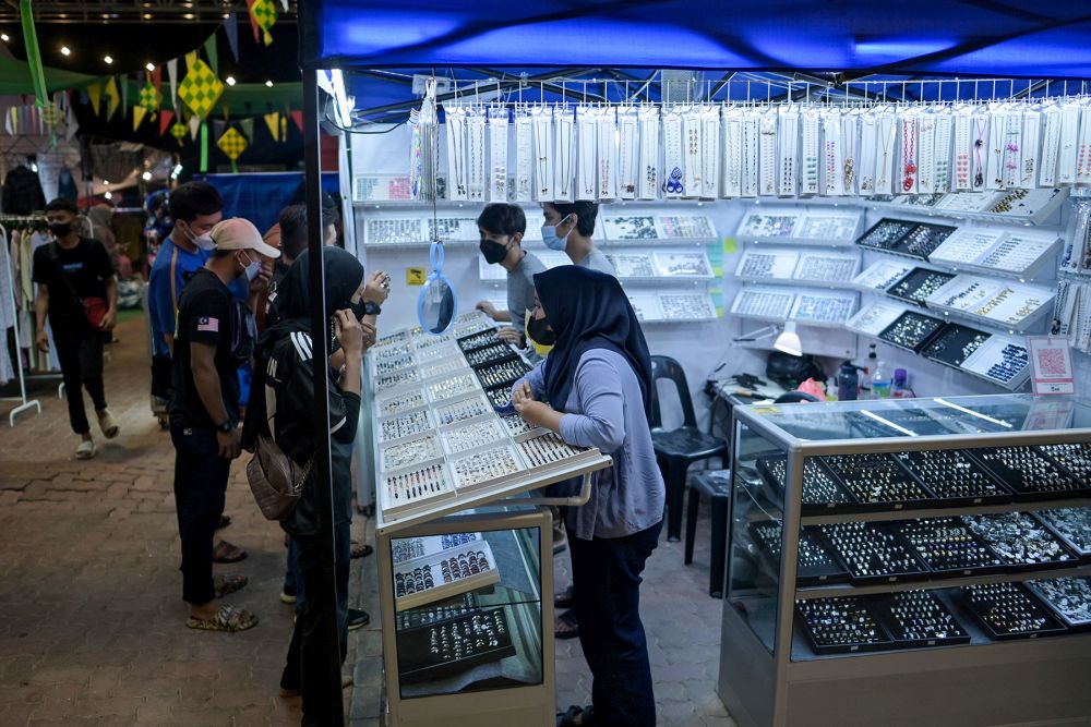 People shop for the upcoming Hari Raya Aidilfitri celebrations in Setia Alam Uptown April 27, 2022. u00e2u20acu201d Picture by Miera Zulyana